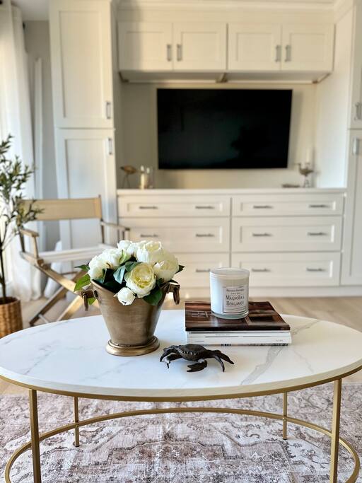 Unwind in our curated Living Room featuring built-ins and a 55” Smart TV, and amazing ocean views from our comfortable new West Elm sofa (Queen Sleeper). Perfect for relaxing with some wine and cheese and a great movie after a long day at the beach.