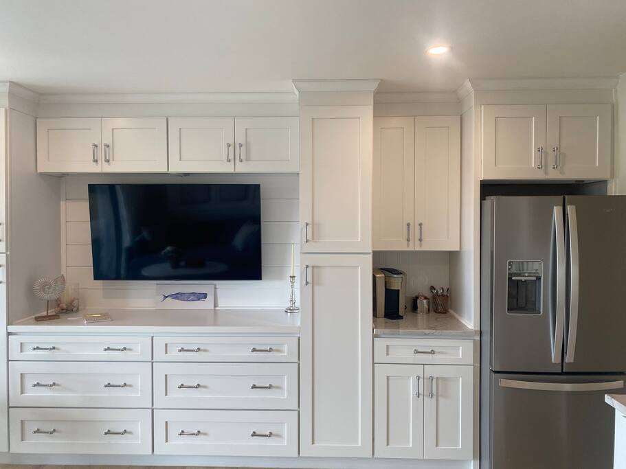 Well-designed Built-ins and Pantry for all your storage needs!  55” Smart TV and Coffee Bar too!