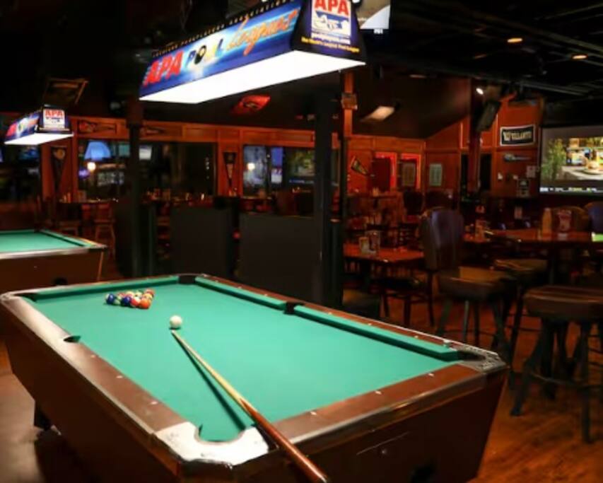 Enjoy a game of billiards while savoring your favorite food and drinks, all while watching your favorite sports teams in action!