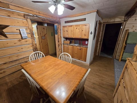 Dining room table seats four people.  Ceiling fan and extra storage room for your items.