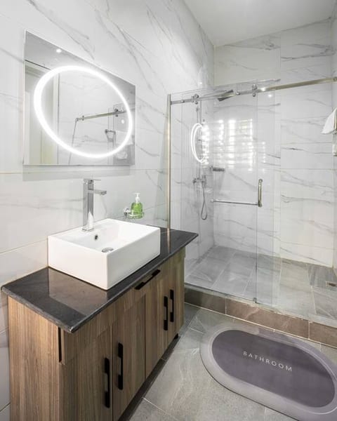 Indulge in comfort and relaxation in our beautiful bathroom. With its modern fixtures, serene ambiance, and thoughtful design, this private sanctuary offers a tranquil escape during your stay.
