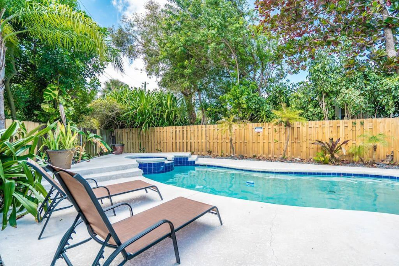 "Crystal-clear water, sunshine dancing on the surface, and palm trees swaying in the breeze - this pool is a slice of paradise found." ✨