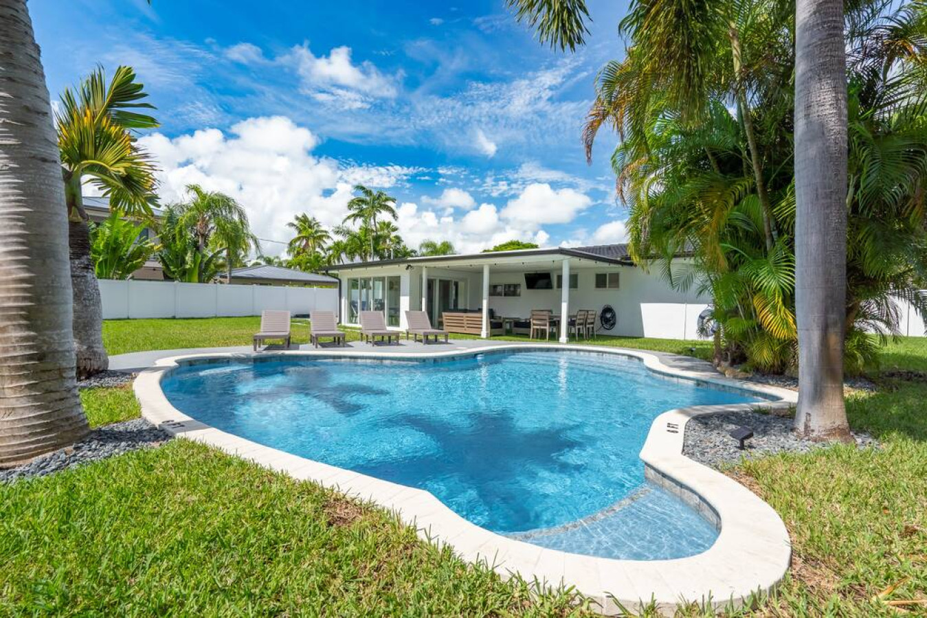 Beautiful, heated saltwater pool with multiple shallow lounge areas