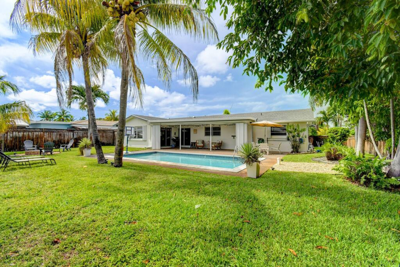 tranquil-oasis:-pool-and-fire-pit-in-boynton/