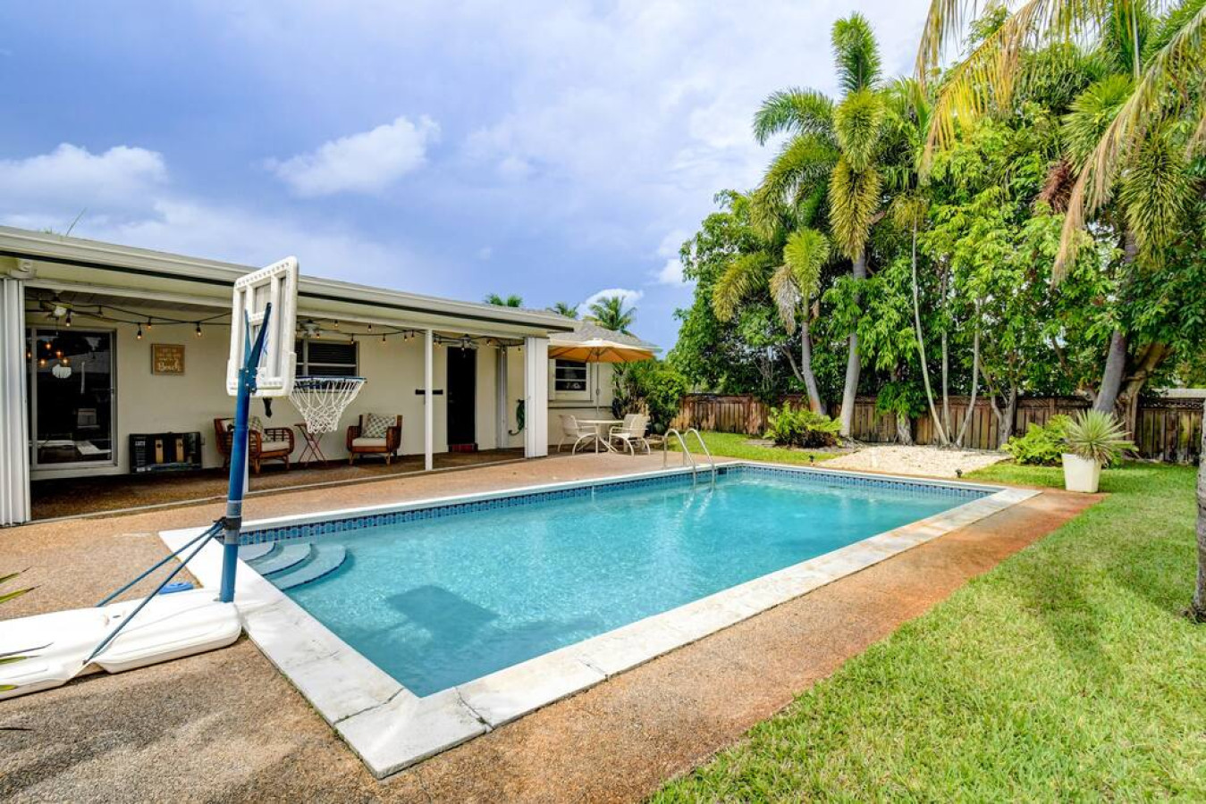 tranquil-oasis:-pool-and-fire-pit-in-boynton/