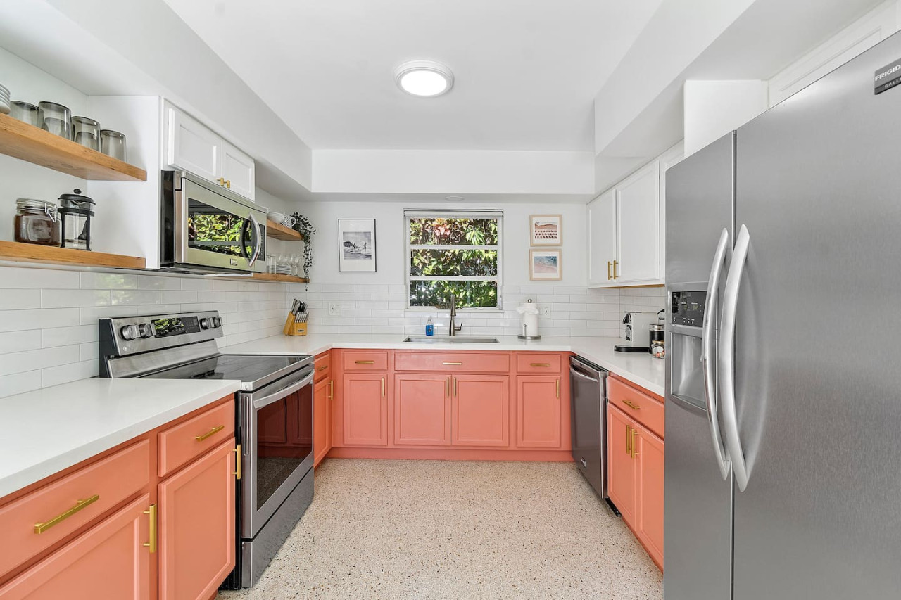 A sleek kitchen with stainless steel appliances, ample counter space, and all the essentials for cooking.
