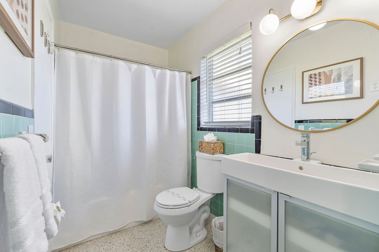 A sleek bathroom equipped with a combination shower and tub, perfect for both quick showers and long, leisurely baths.