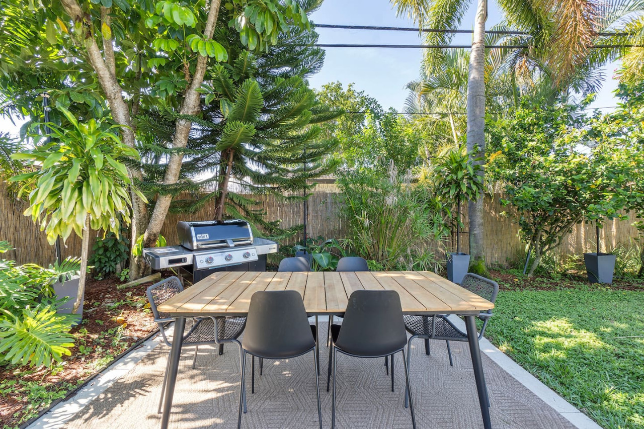 A spacious outdoor dining setup featuring a table for six, ideal for enjoying meals in the fresh air.