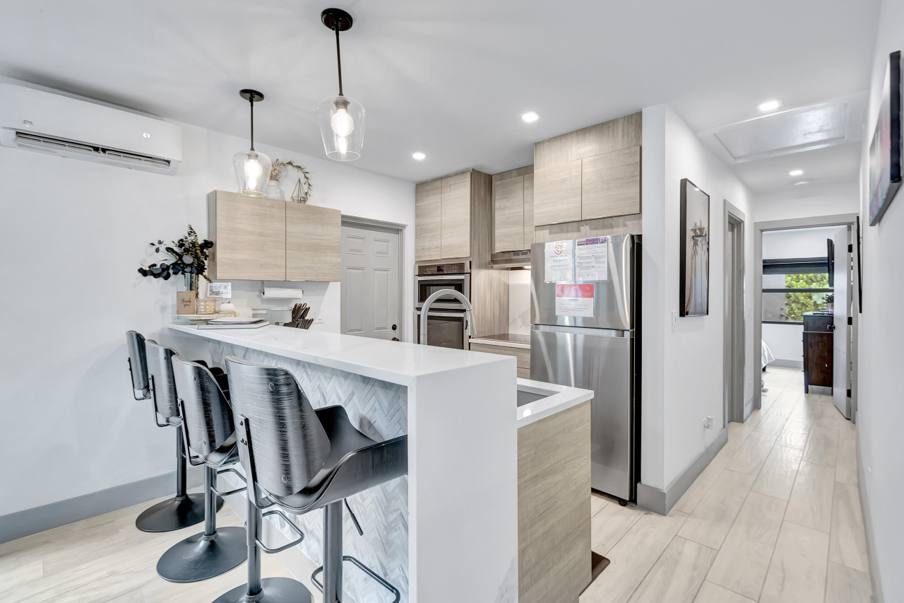 Unit 1 features a modern kitchen fully equipped for all your culinary needs.