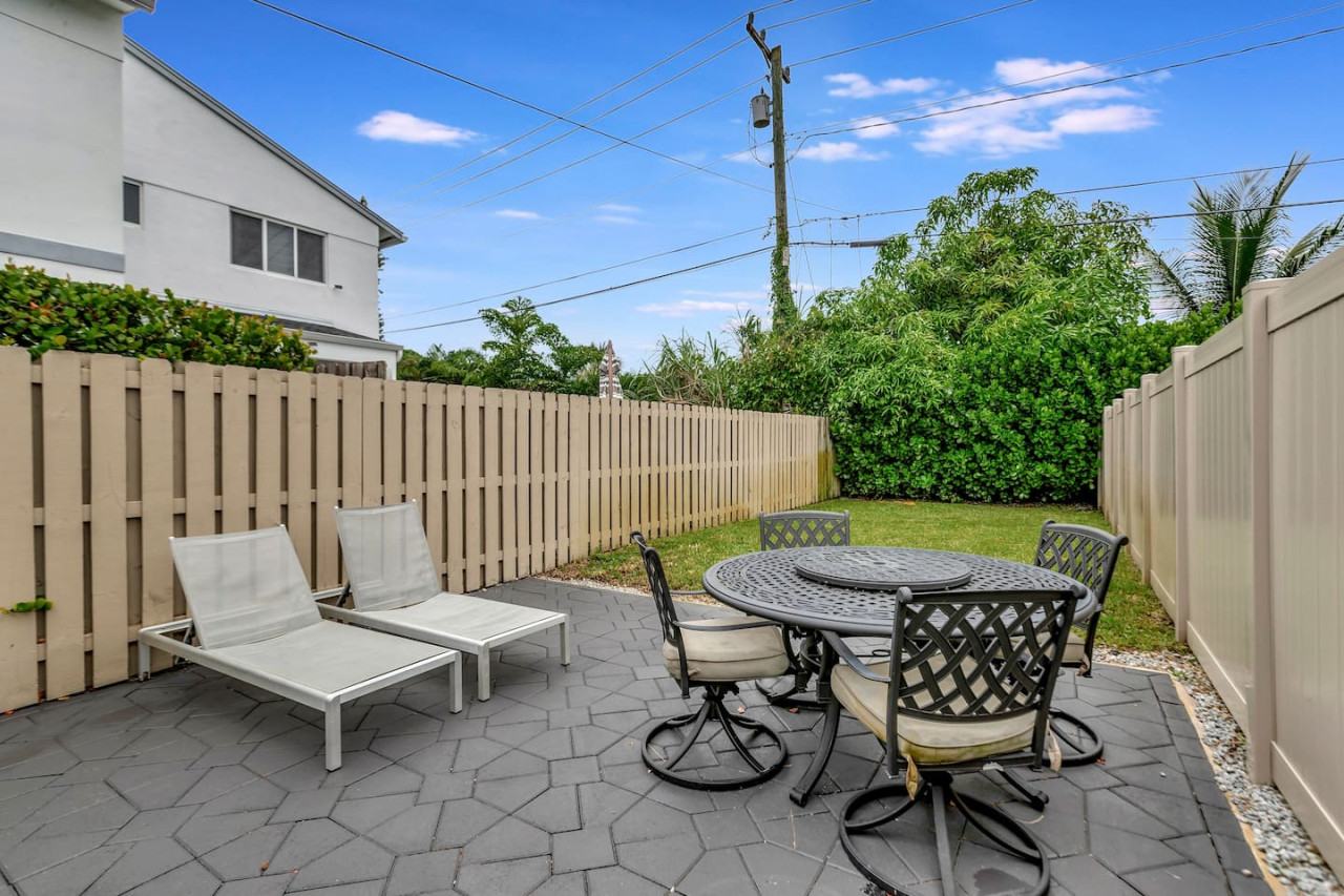 Discover the beauty of Unit 1's backyard, a perfect spot for evening sunsets and barbecues.