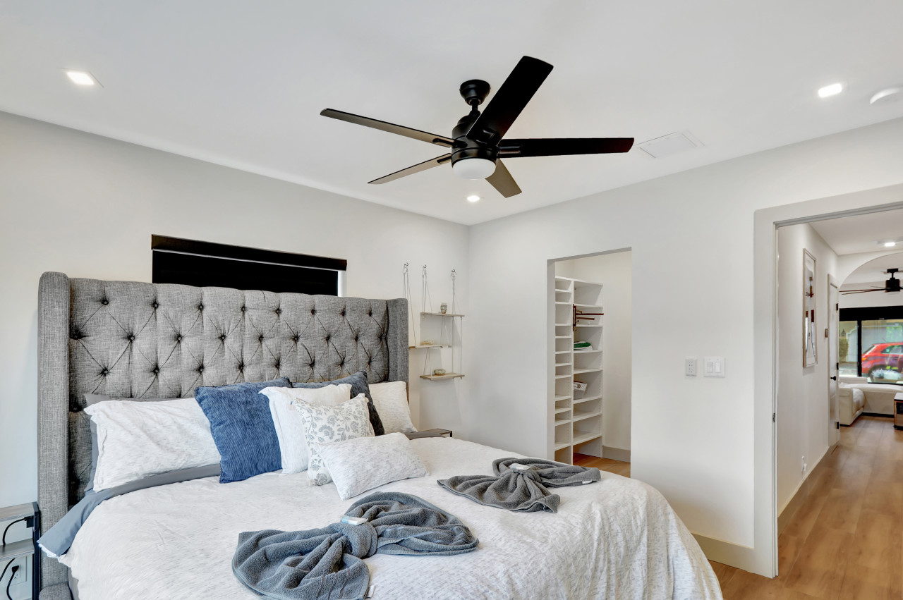 Unit 2, Bedroom 1: Relax in a king bed with convenient backyard access.