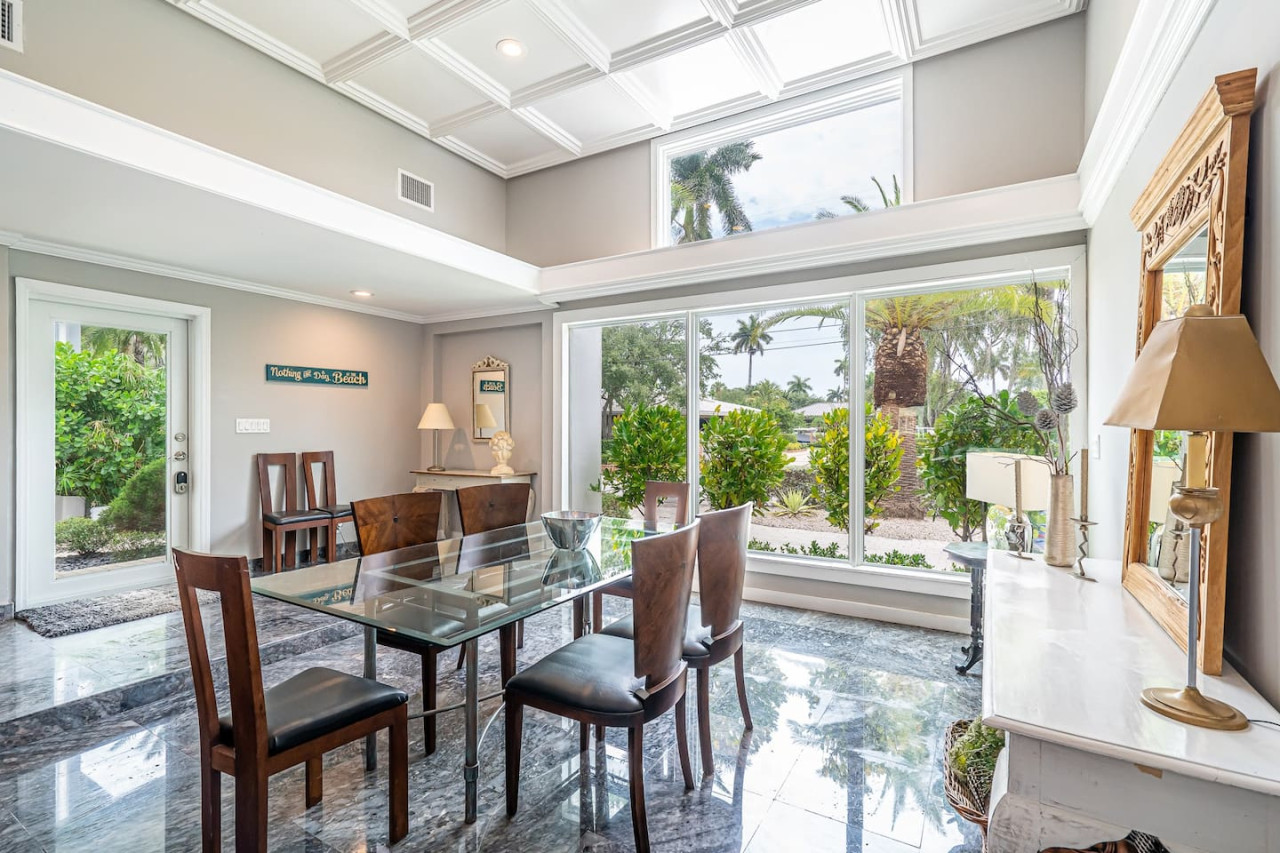 A touch of elegance with a glass table and velvet chairs. This dining room is perfect for a special occasion.