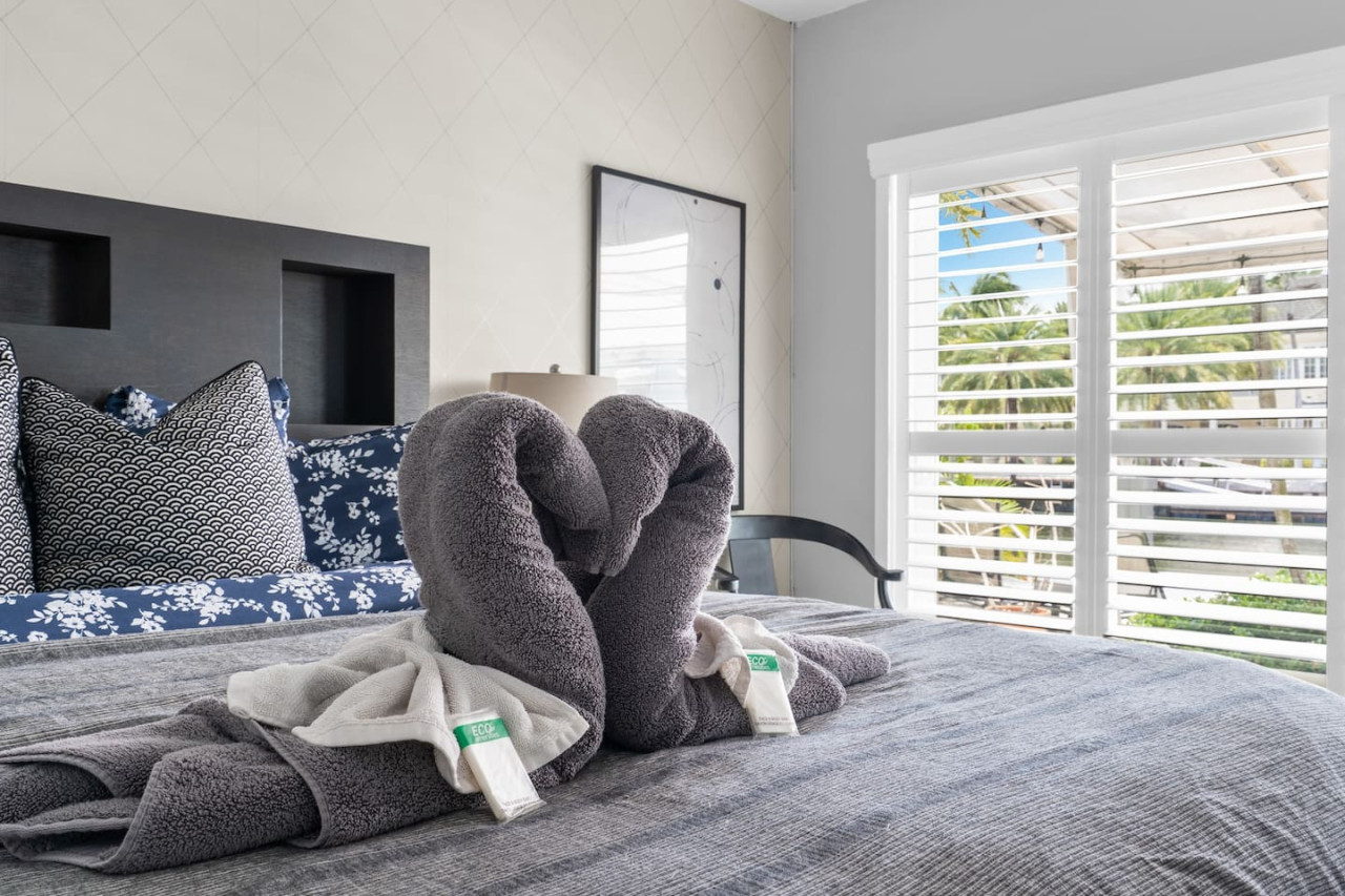 Waking up to this serene bedroom would be a dream. The soft colors and natural light create a calming atmosphere.