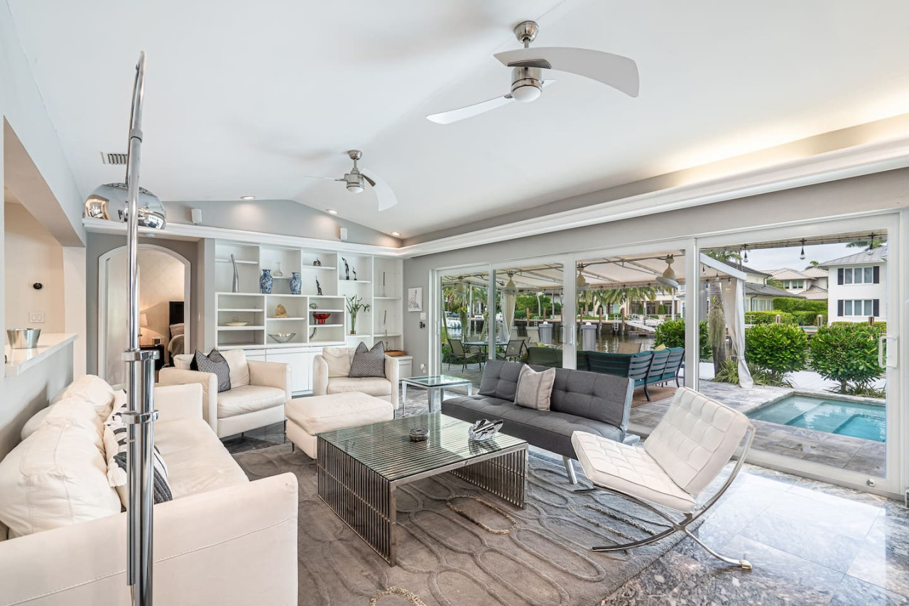 Bright and airy living room with a modern ceiling fan.