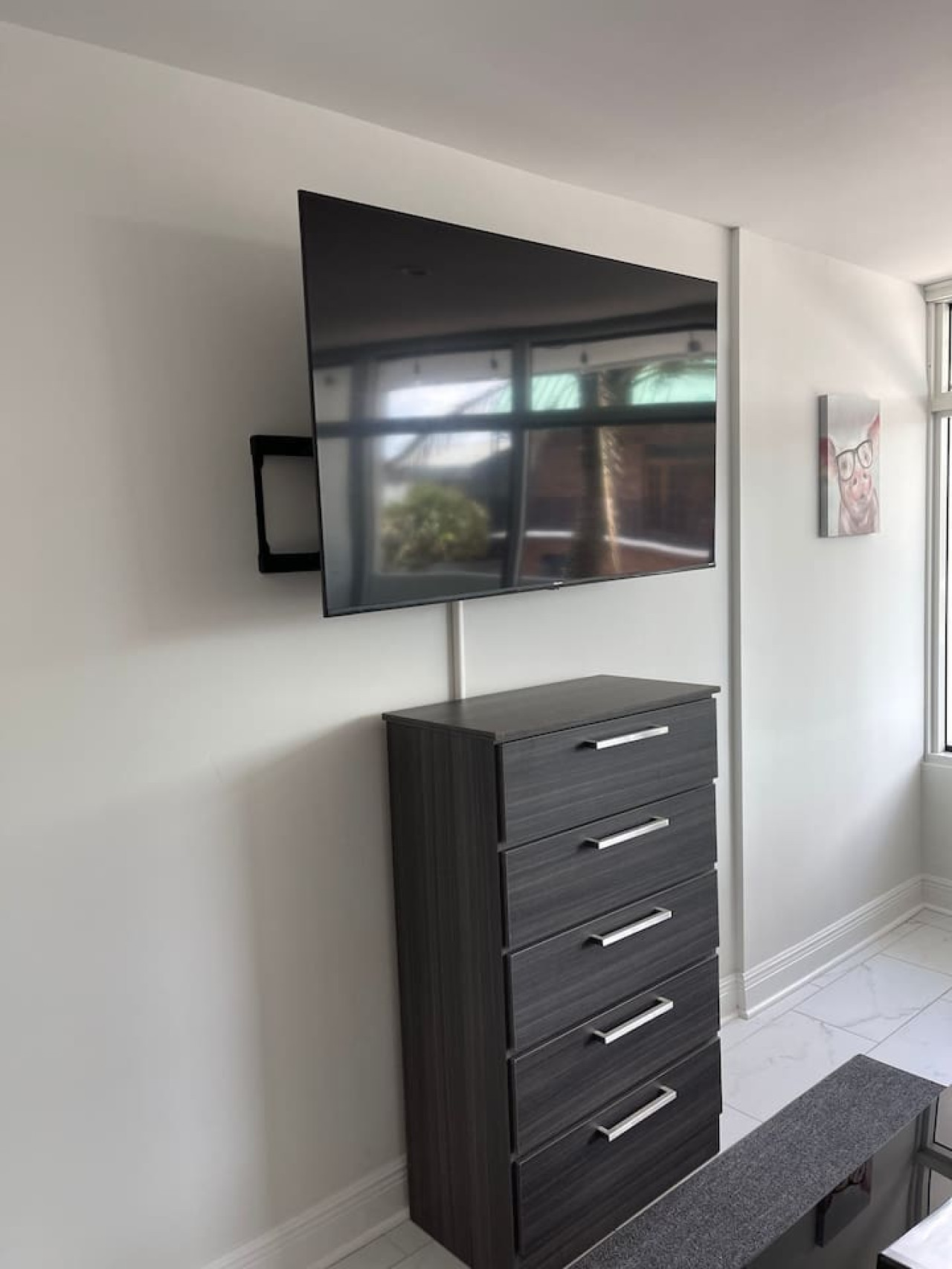 Modern oasis: This sleek and minimalist TV room is the perfect place to escape the hustle and bustle of everyday life.