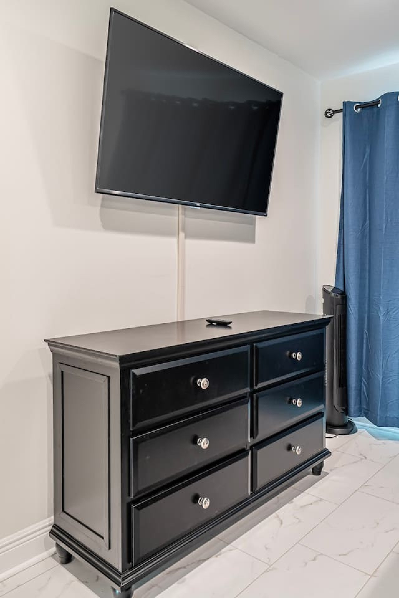 Relax and recharge: After a long day, unwind in this stylish and comfortable TV room.