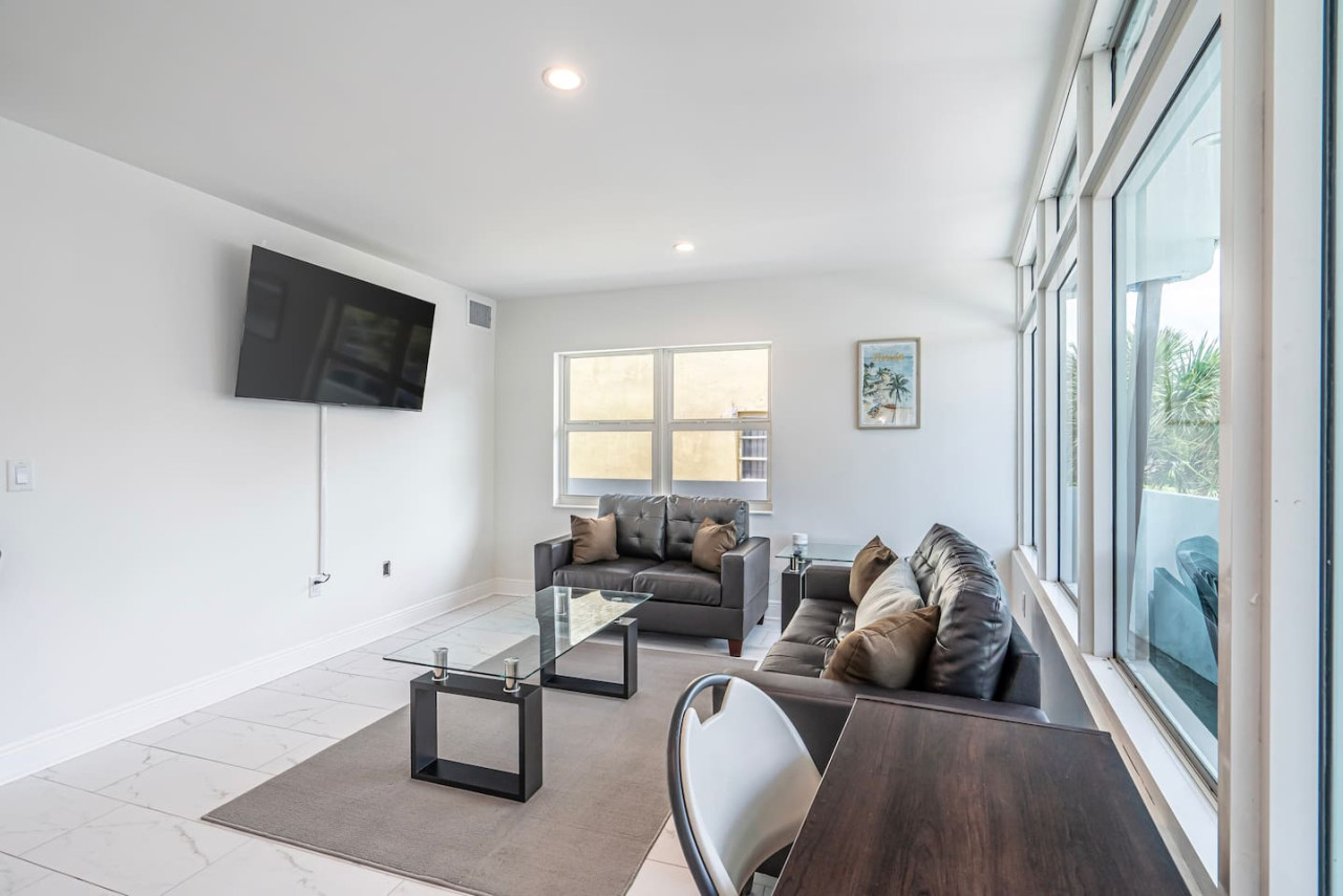 "Movie night ready: This living room has everything you need for a perfect night in, from the comfy sectional couch to the big-screen TV."