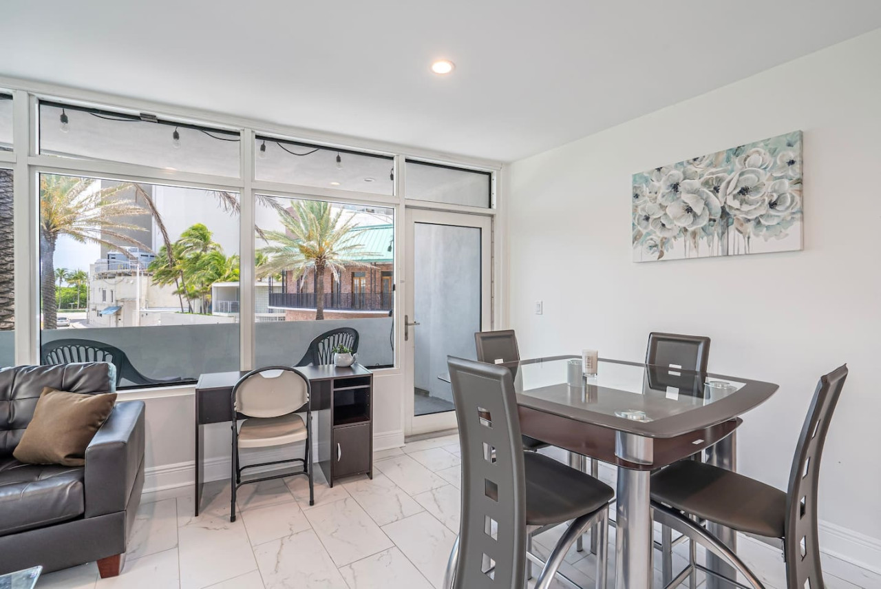 "Dinner with a view": The artwork on the wall adds a touch of whimsy and conversation to this elegant dining room.