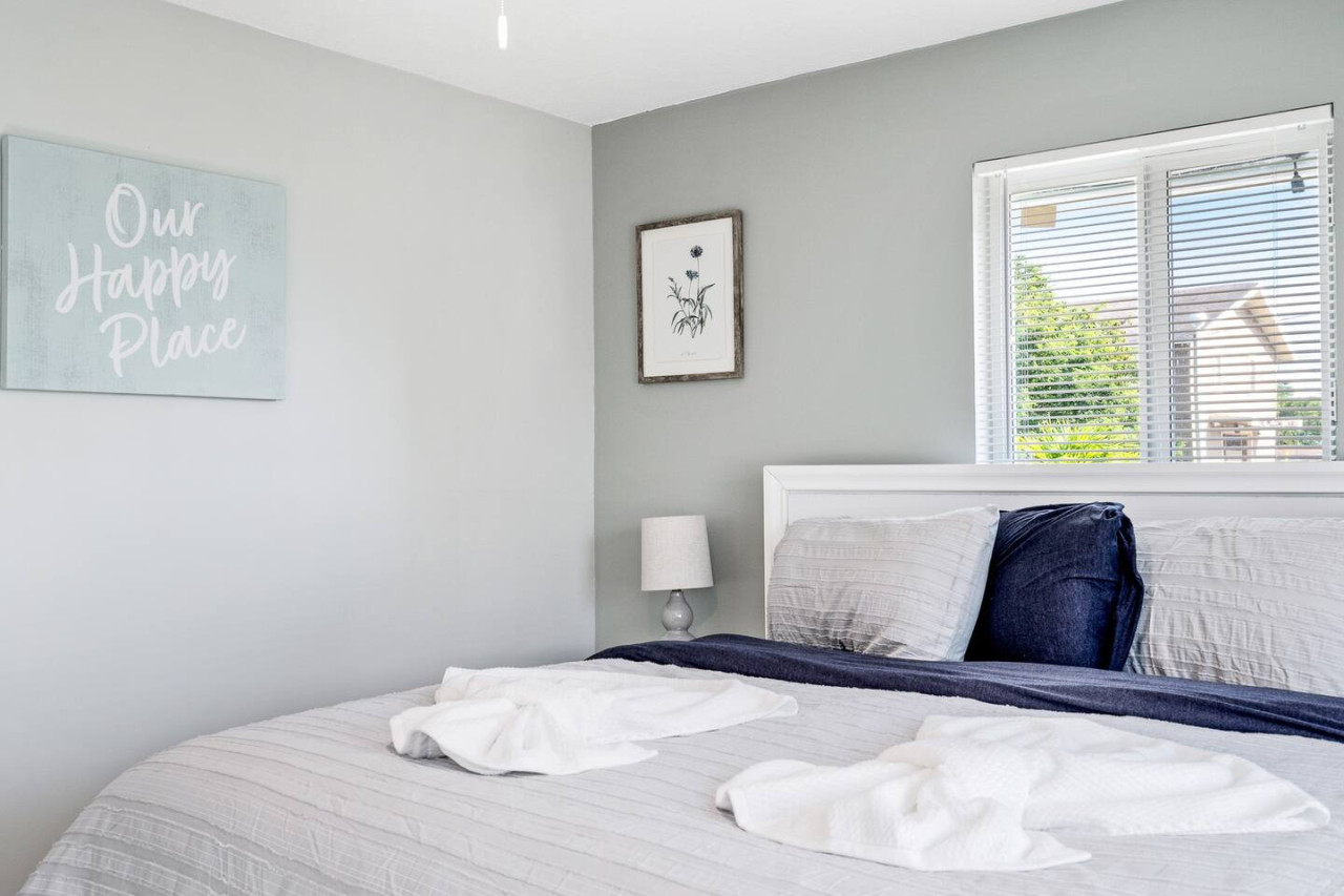 This bedroom is the perfect retreat after a long day, with a cozy bed and a view to die for.