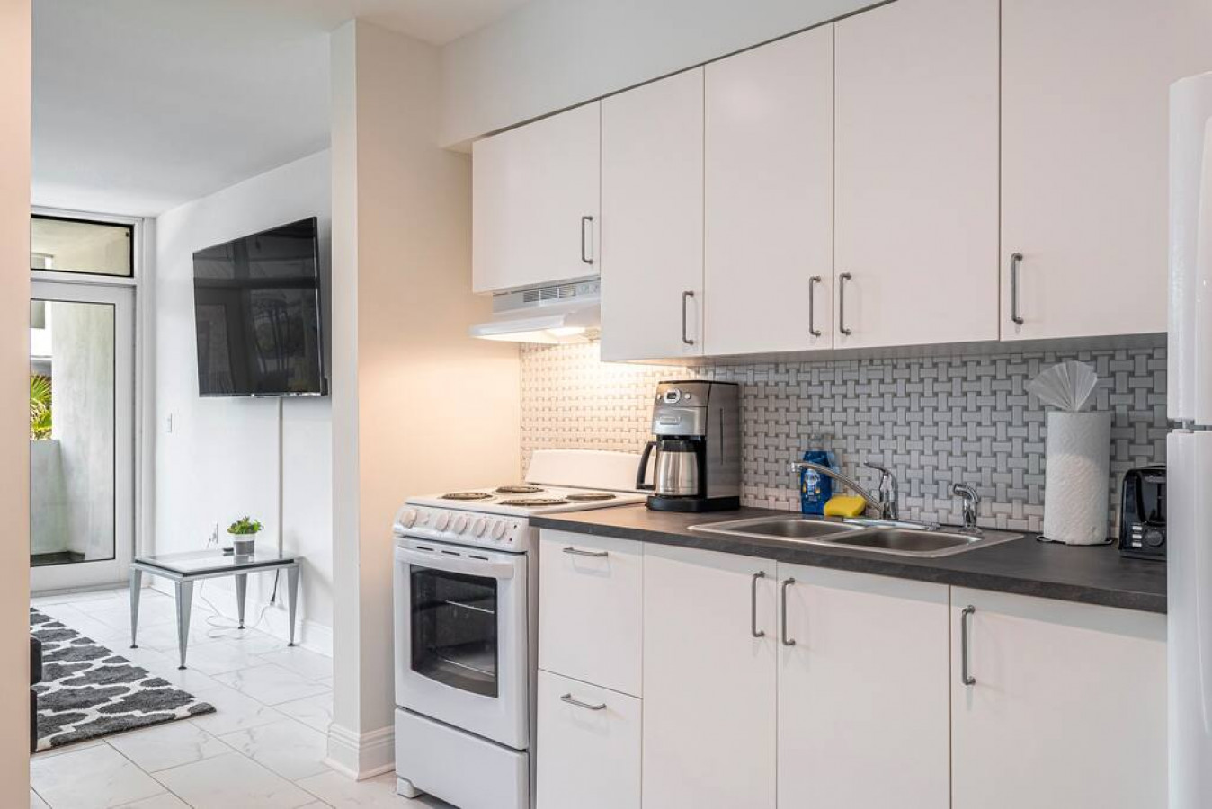 Heart of the home: This inviting kitchen is the perfect place to gather with friends and family, whether you're cooking up a feast or simply enjoying a cup of coffee.