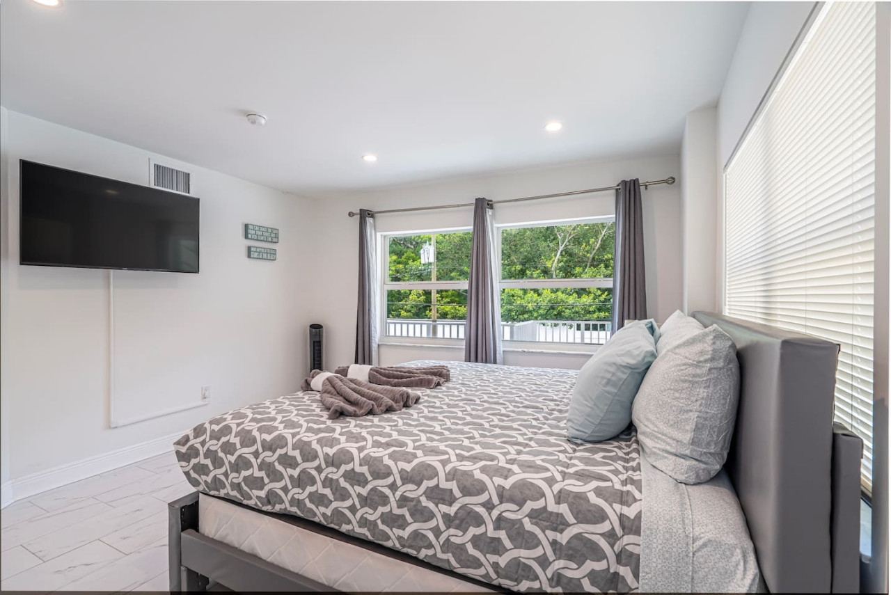 Step onto your private balcony and breathe in the fresh air in this bedroom designed for relaxation.
