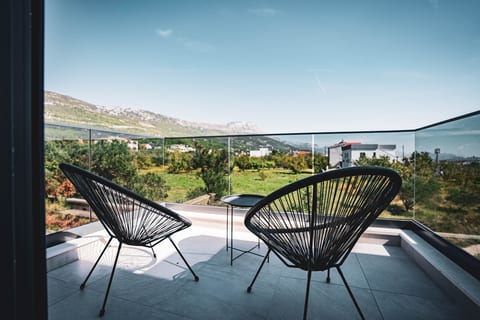 large balcony on the first floor - each bedroom has one - with seatings to enjoy warm summer nights