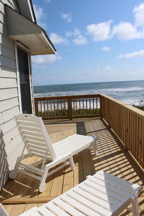 The u-shaped top deck provides shade on one side and a lounge area on the other both with ocean views.