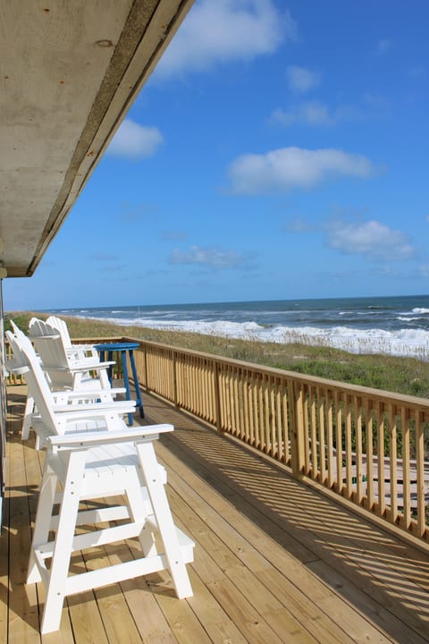 The entire back top deck runs the width of the house with perfect unobstructed views of the ocean and the sandy beach.