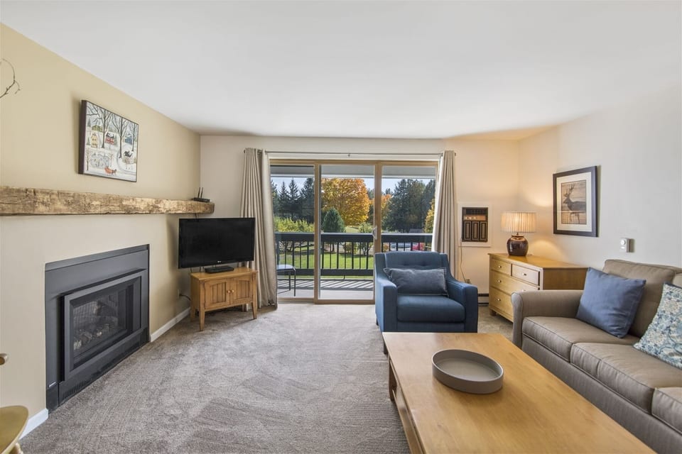 Well-appointed living room with deck access