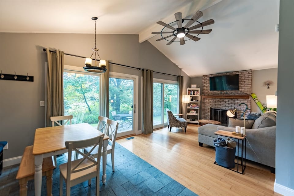Updated living room opens to large back patio and hot tub