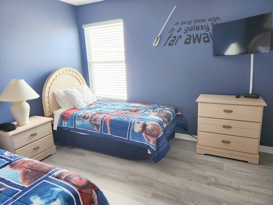 This Star Wars themed room features twin beds and a smart tv

The twin bedrooms share a bathroom which offers a shower, bath tub, sink and toilet - PREMIUM 5 Bed, 4 Bath Villa w/Pool, Near Disney  - Davenport