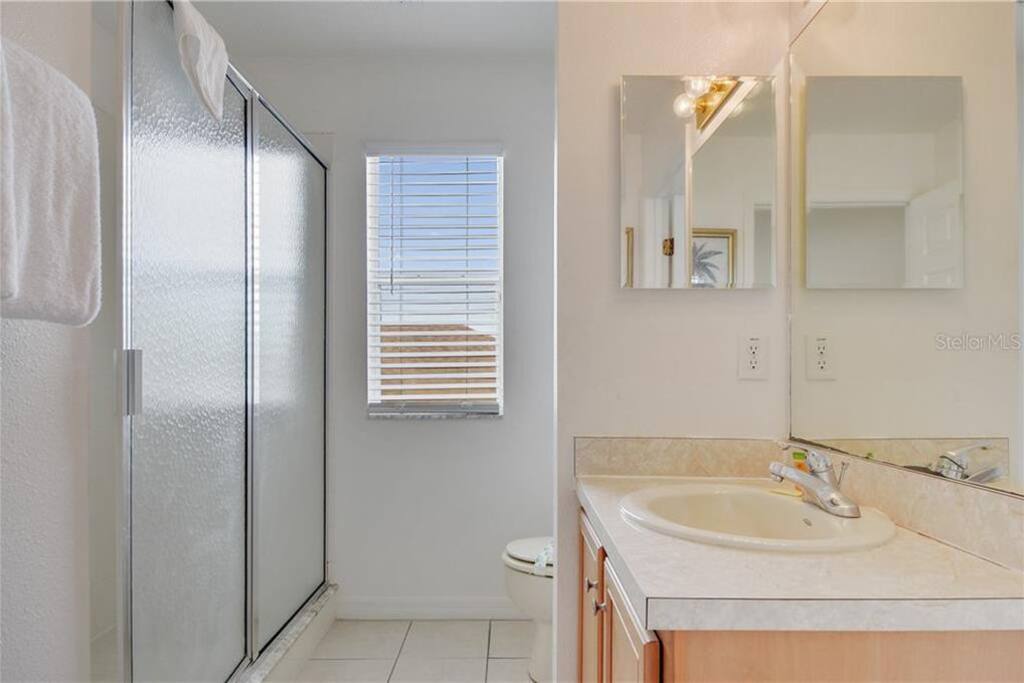 The ensuite bathroom provides a bath tub, shower, sink and toilet The ensuite bathroom provides a bath tub, shower, sink and toilet - PREMIUM 5 Bed, 4 Bath Villa w/Pool, Near Disney - Davenport