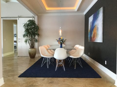 Stylish indoor dining with pool and lake views