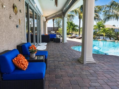 Waterside patio area with retractable screens