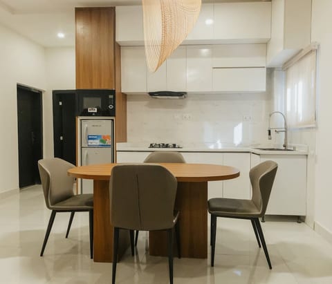 Discover a dining area retreat where exclusivity meets modern elegance in a stylish, luxurious setting.