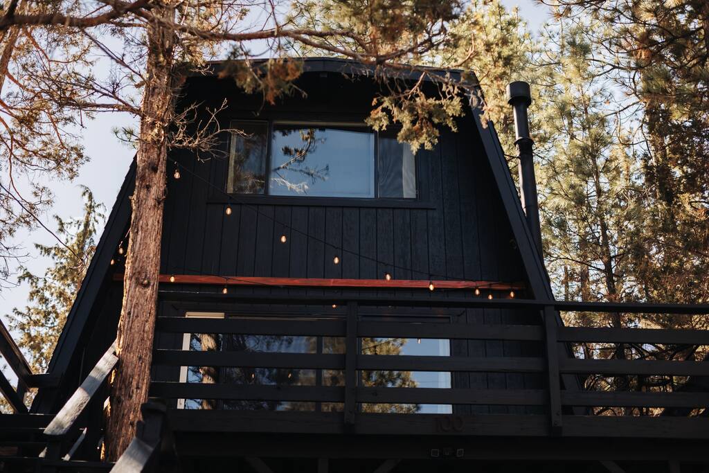 An elevated wrap around deck with a view