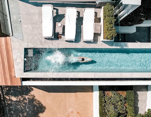 Swimming pool with outdoor loungers