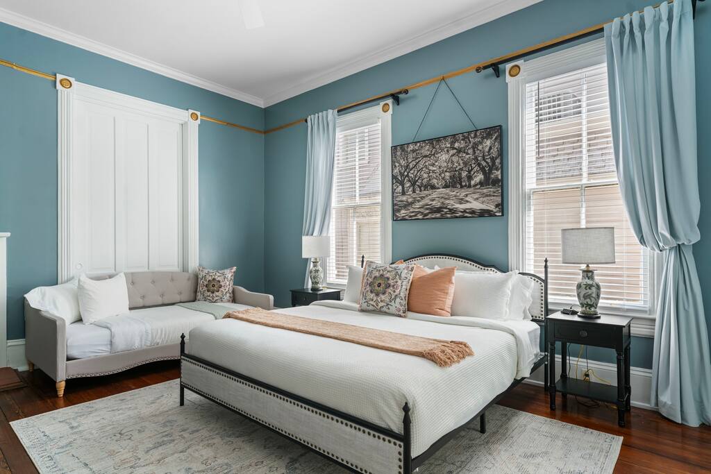 Large 1st floor bedroom featuring a comfy king bed and twin day bed.  A beautiful antique armoire and sitting area also grace the stunning room.  