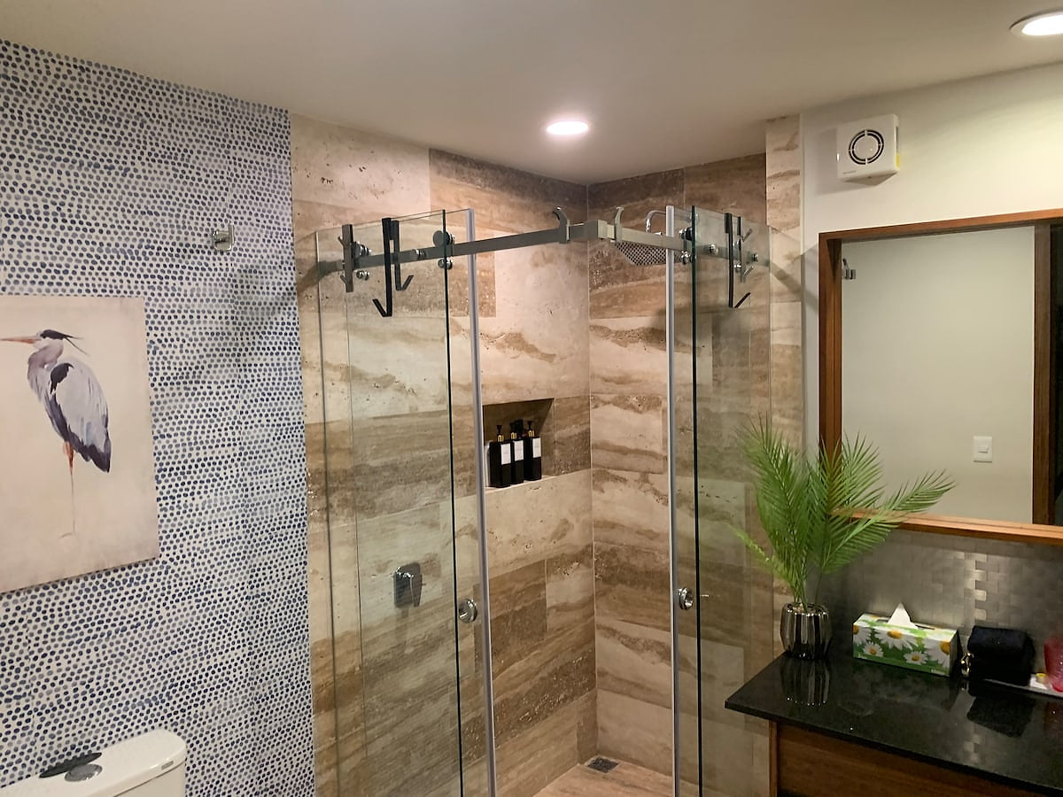 "Indulge in a luxurious spa-like experience in this ensuite bathroom. The sleek design, elegant tilework, and spacious shower create a serene and relaxing atmosphere. Unwind after a long day and refresh your senses."