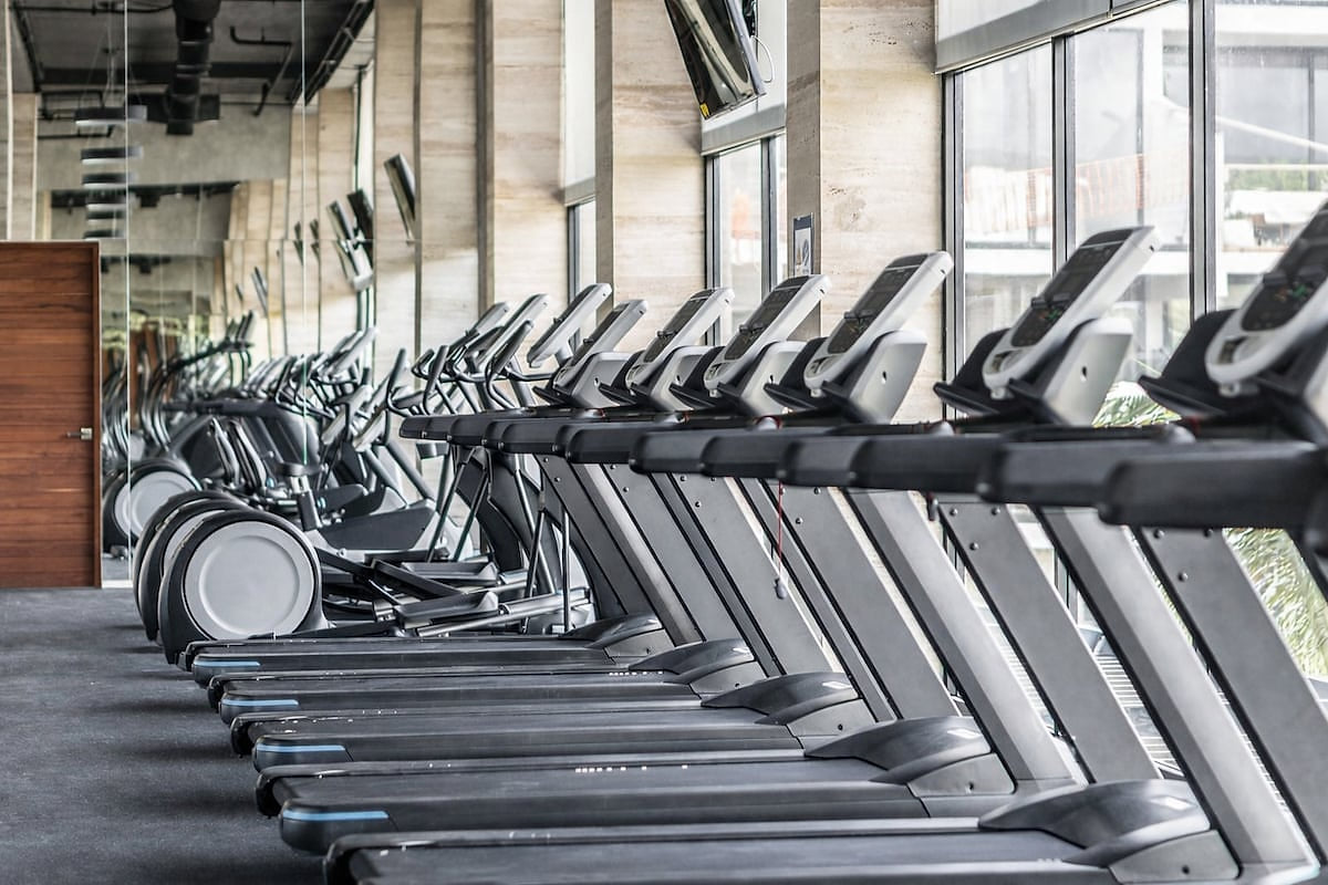 Modern cardio area with multiple treadmills at AWA Playacar, offering a bright, well-maintained fitness space for guests visiting Playa del Carmen