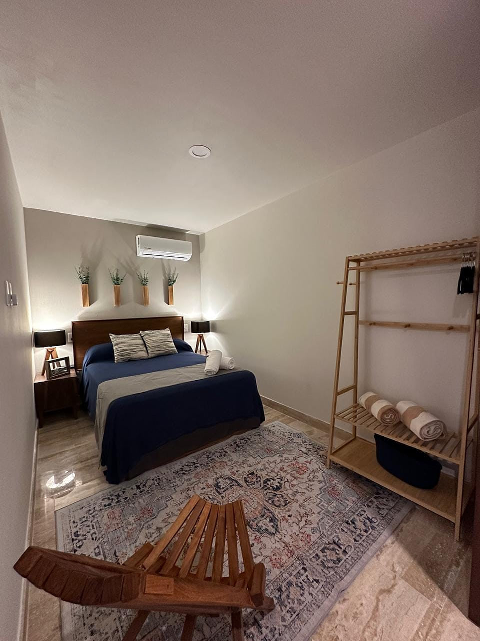 Cozy and comfortable bedroom with a Queen-size bed and plush bedding. Relax and unwind in this peaceful space.   NOTE: the door is slatted and not totally private as it adjoins to the hallway.  