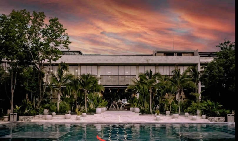  Immerse yourself in the luxury and tranquility of AWA Playacar Residences. This stunning beachfront property offers breathtaking views and world-class amenities.