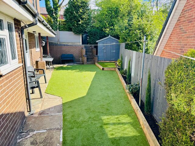 Private side garden with garden furniture