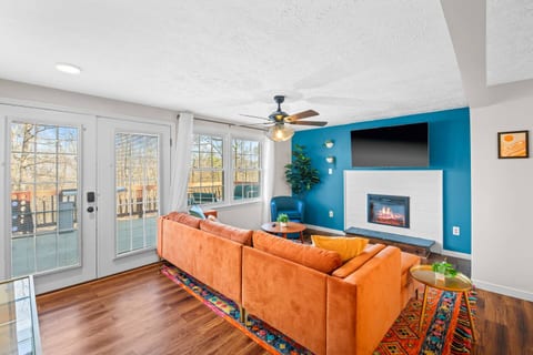 Thoughtfully designed cozy living room for ultra comfort. Enjoy the board games during the day with ample sunshine. When it gets dark, turn on the electric fireplace, play a movie, tuck yourself inside a throw & enjoy your popcorn