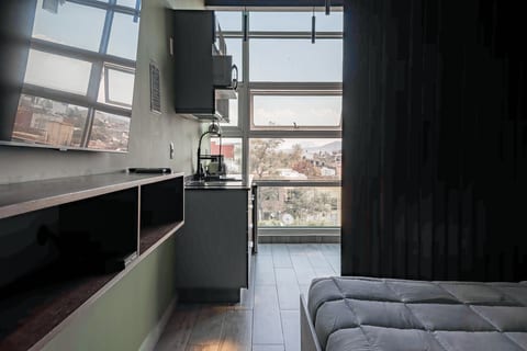 The Jungle Loft – Tropical Comfort in a Centric Location with Kitchen
