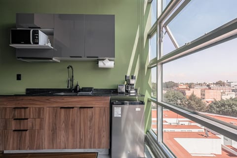 The Jungle Loft – Tropical Comfort in a Centric Location with Kitchen