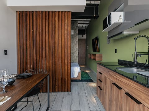 The Jungle Loft – Tropical Comfort in a Centric Location with Kitchen