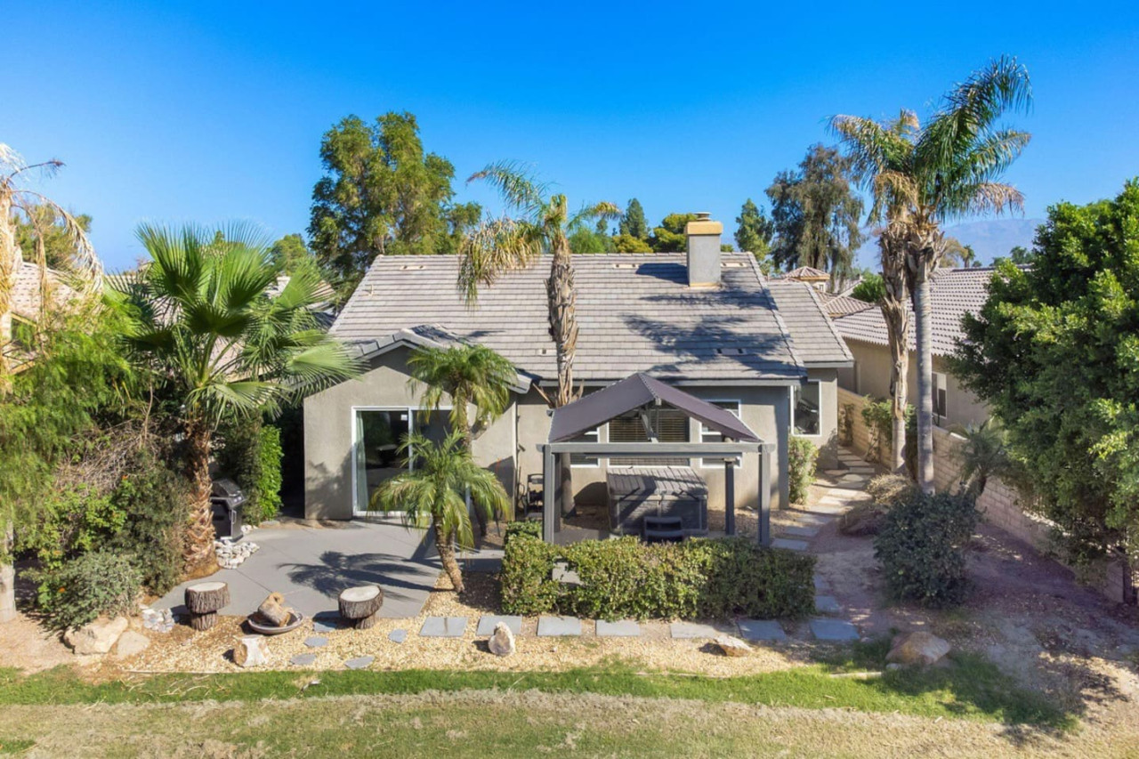 Outdoor Retreat: Relax in the sun surrounded by palm trees and lush landscaping! Perfect for gatherings.