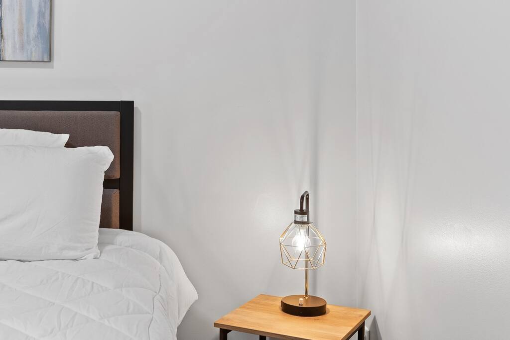 Each nightstand is equipped with a lamp featuring charging ports, so you can effortlessly charge your devices without the hassle of reaching behind furniture. Each nightstand is equipped with a lamp featuring charging ports, so you can effortlessly charge your devices without the hassle of reaching behind furniture. - N. Chatt Charm - 2 Bedroom - Walk to Walnut St Bridge, Coolidge Park, and the river! - Chattanooga