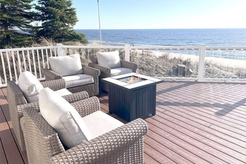 Four comfortable chairs that both rock and swivel to get the best views of the beach and lake.